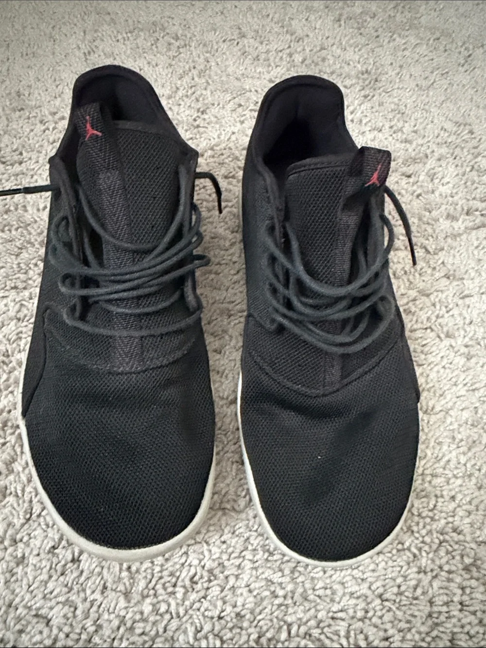 Jordan Men’s Black Sneakers with Red Jumpman Accent